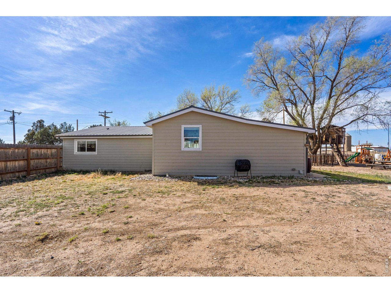 1083 2nd Street Nunn, CO 80648 - Photo 44 of 50 a house view with a backyard space