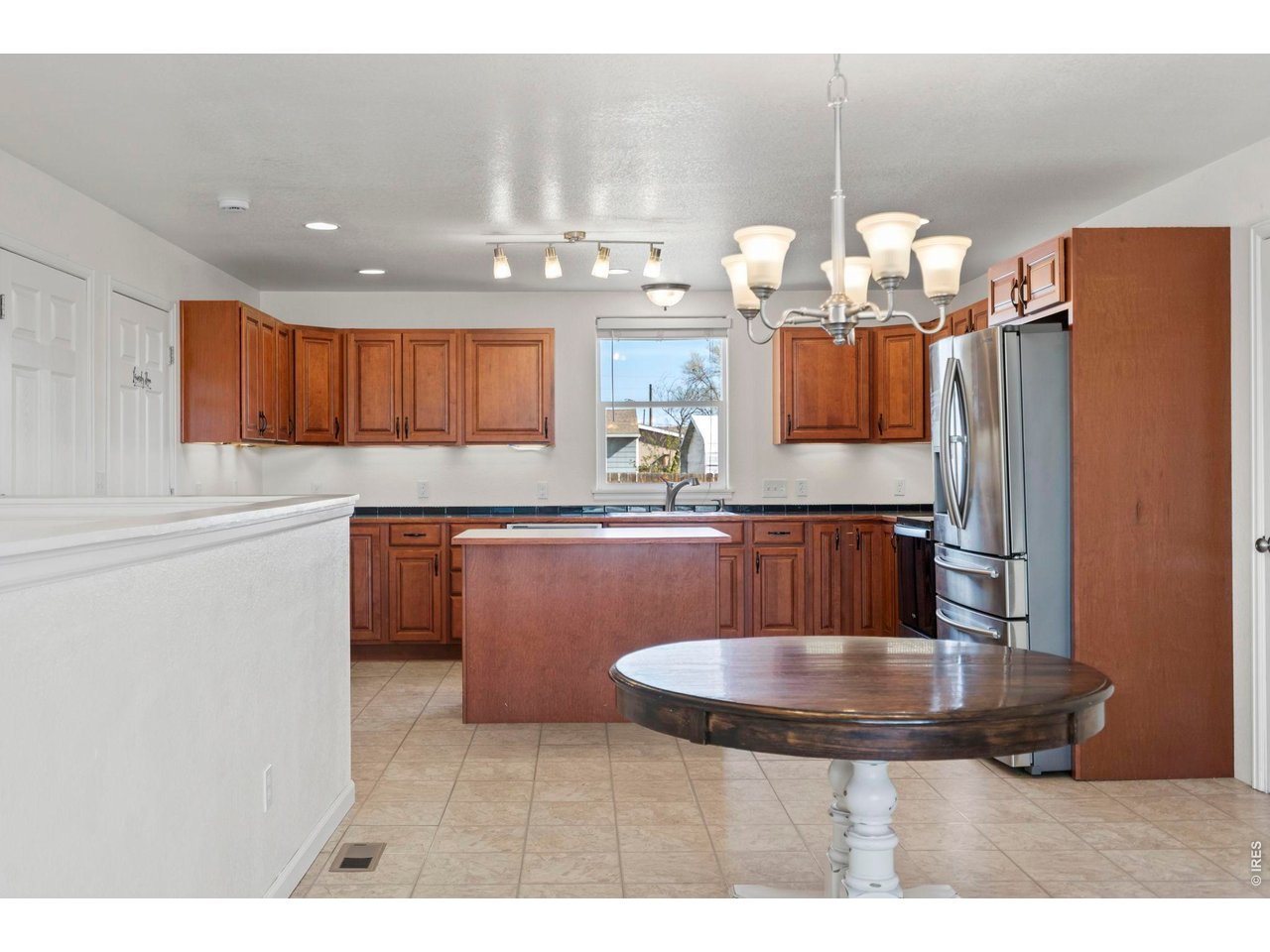 1083 2nd Street Nunn, CO 80648 - Photo 7 of 50 a kitchen with granite countertop a sink cabinets and stainless steel appliances