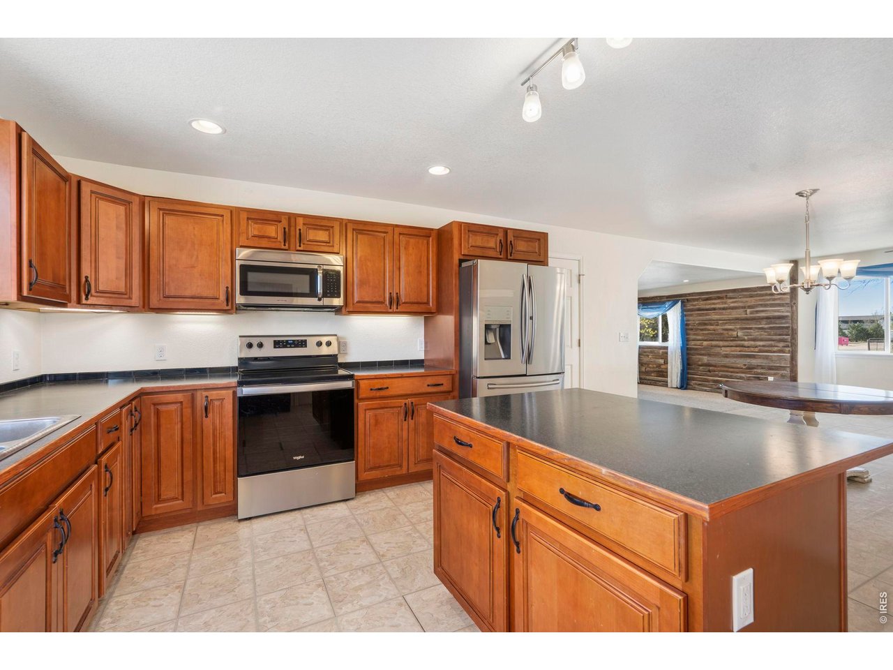 1083 2nd Street Nunn, CO 80648 - Photo 10 of 50 a kitchen with stainless steel appliances granite countertop a sink stove and refrigerator