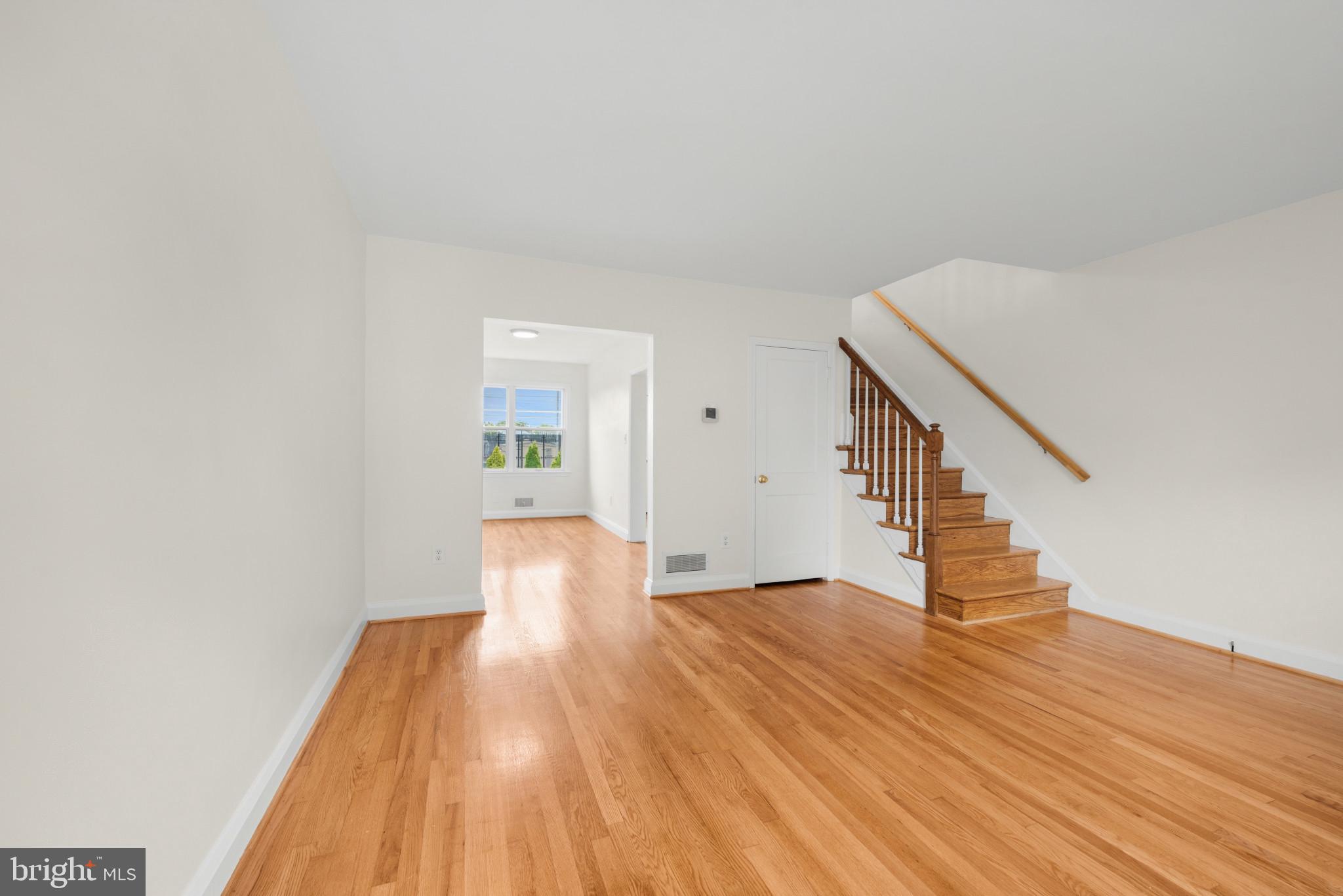 2207 Hawthorne Road Baltimore, MD 21220 - Photo 6 of 39 a view of a hallway with wooden floor and staircase