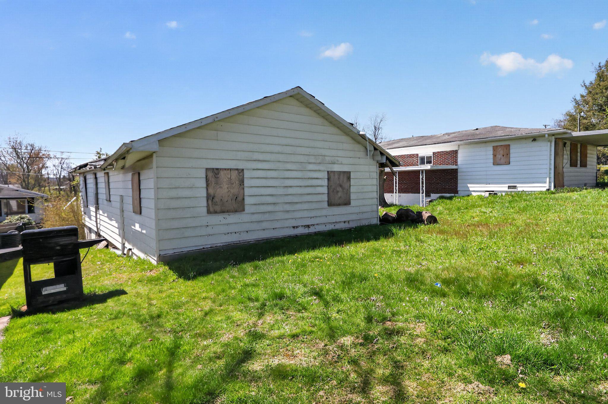 113 Cannaday Street Beckley, WV 25801 - Photo 2 of 14 a backyard of a house with table and chairs