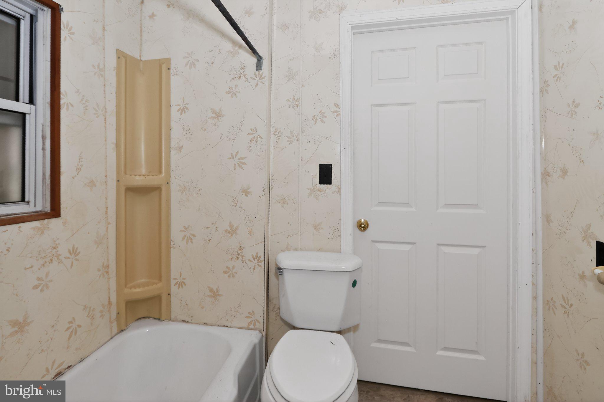113 Cannaday Street Beckley, WV 25801 - Photo 6 of 14 a bathroom with a toilet and a shower