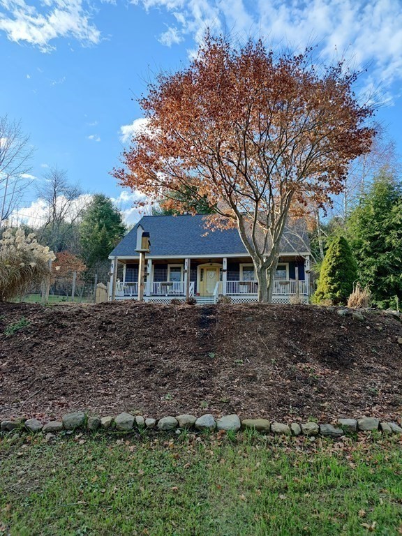 45 Fiskdale Road Brookfield, MA 01506 - Photo 1 of 36 a front view of a house with a garden