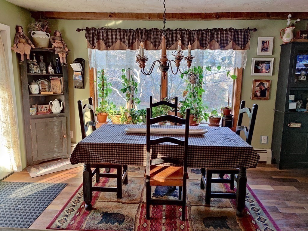 45 Fiskdale Road Brookfield, MA 01506 - Photo 18 of 36 a view of a dining room with furniture and chandelier