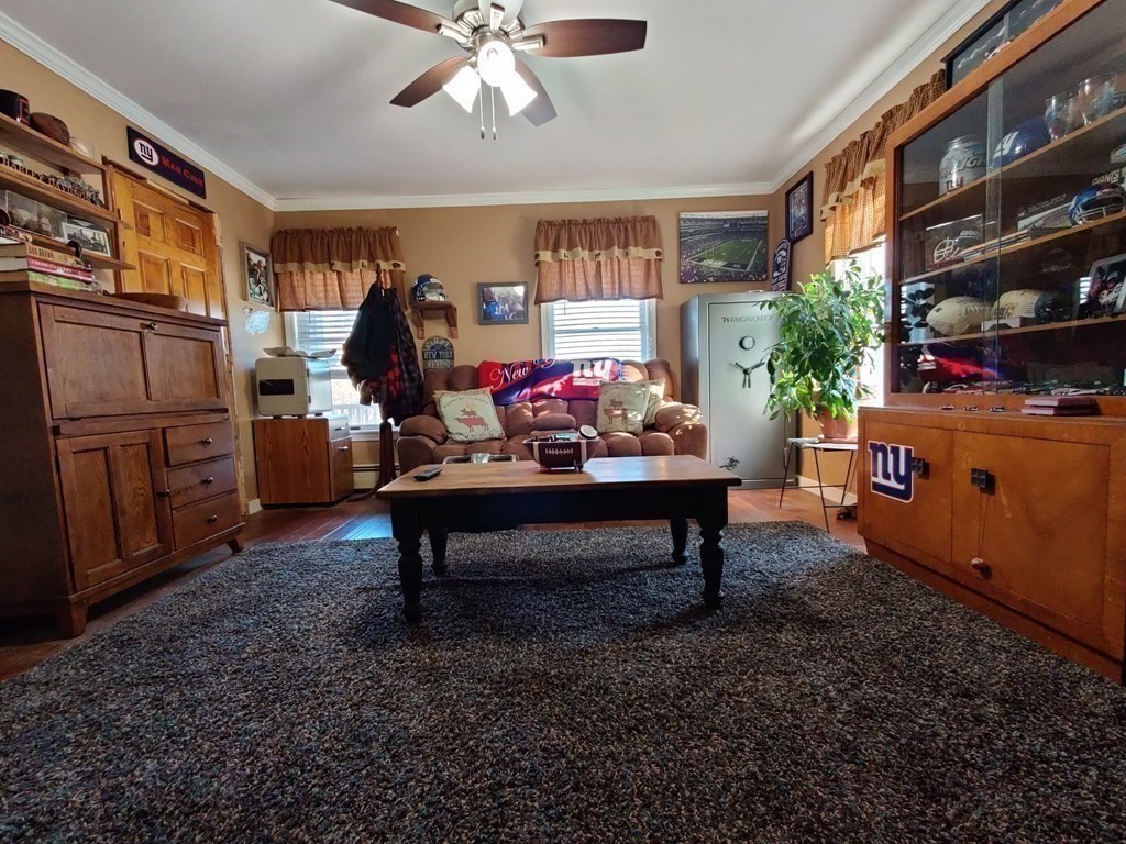 45 Fiskdale Road Brookfield, MA 01506 - Photo 26 of 36 a living room with furniture and a chandelier