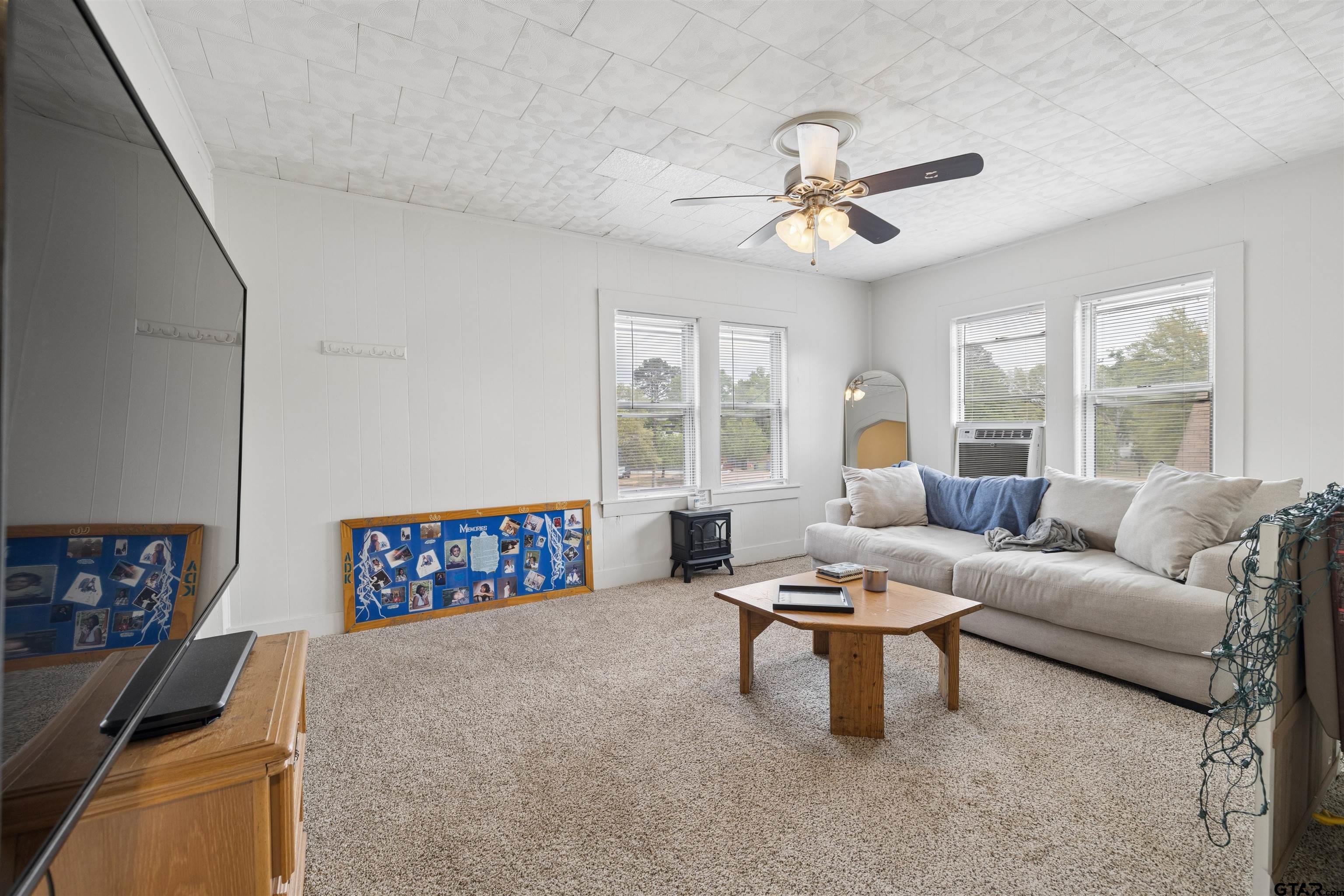 1010 Maple Street Kilgore, TX 75662 - Photo 12 of 20 a living room with furniture and a large window