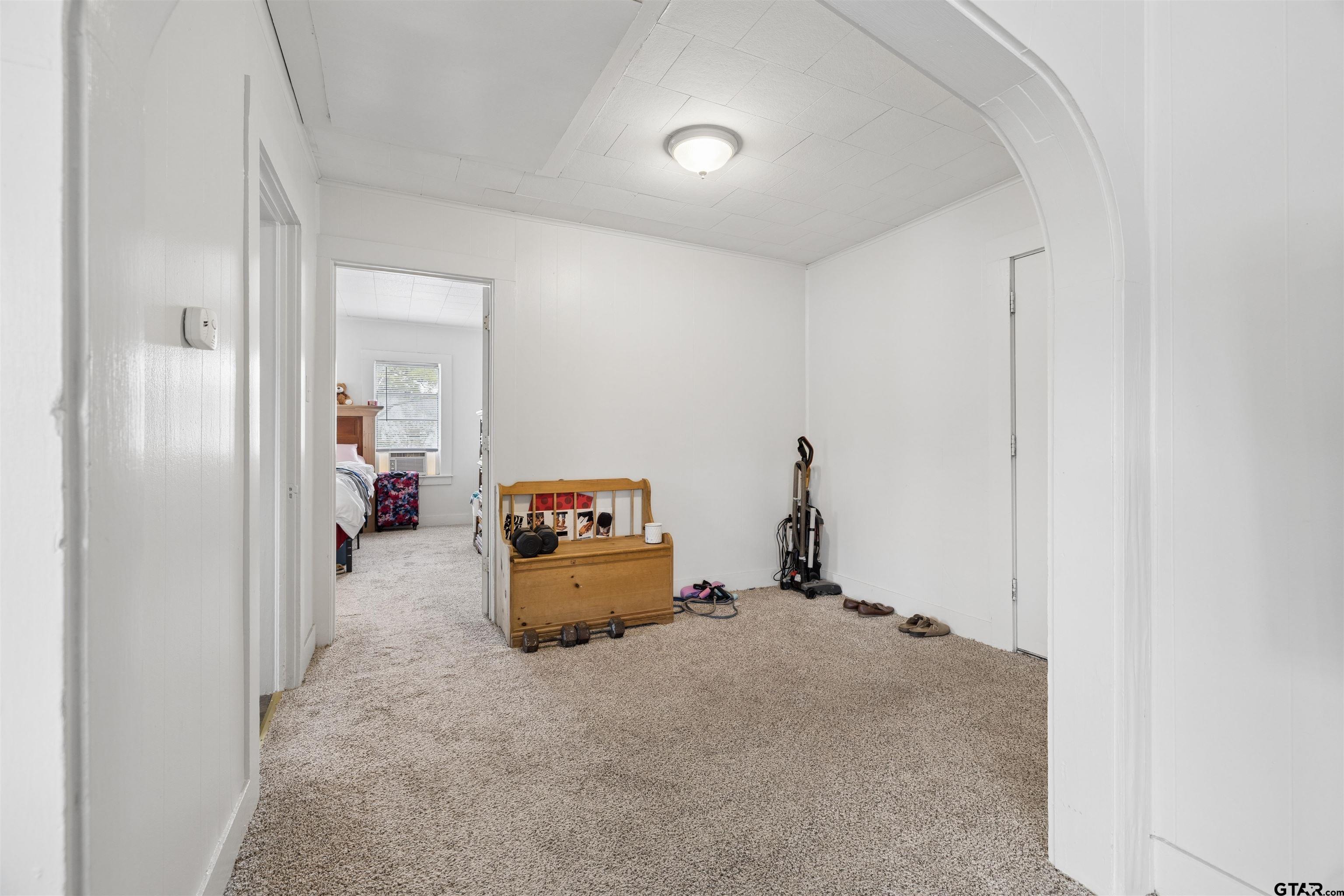 1010 Maple Street Kilgore, TX 75662 - Photo 17 of 20 a living room with furniture and a window