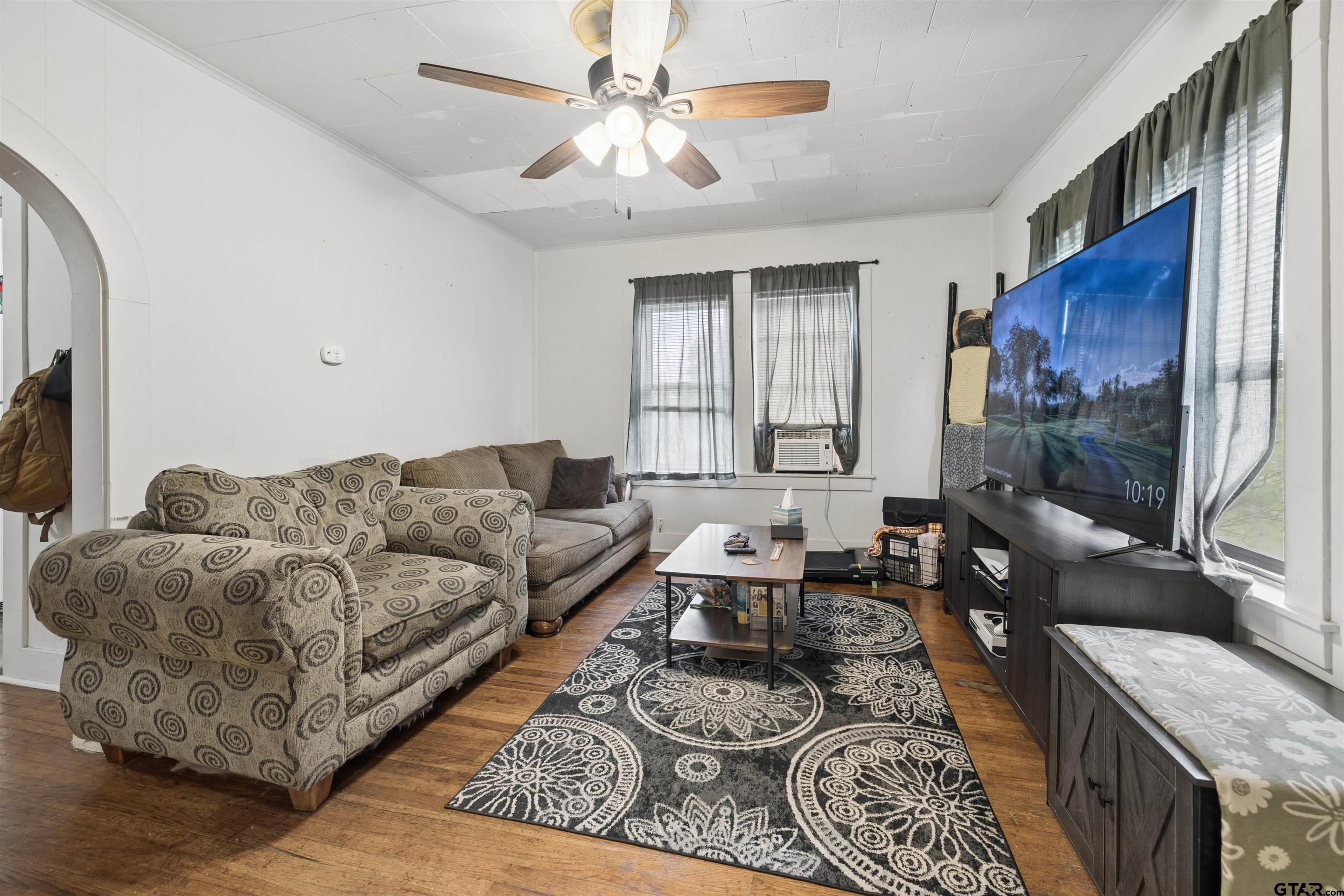1010 Maple Street Kilgore, TX 75662 - Photo 2 of 20 a living room with furniture and a fireplace
