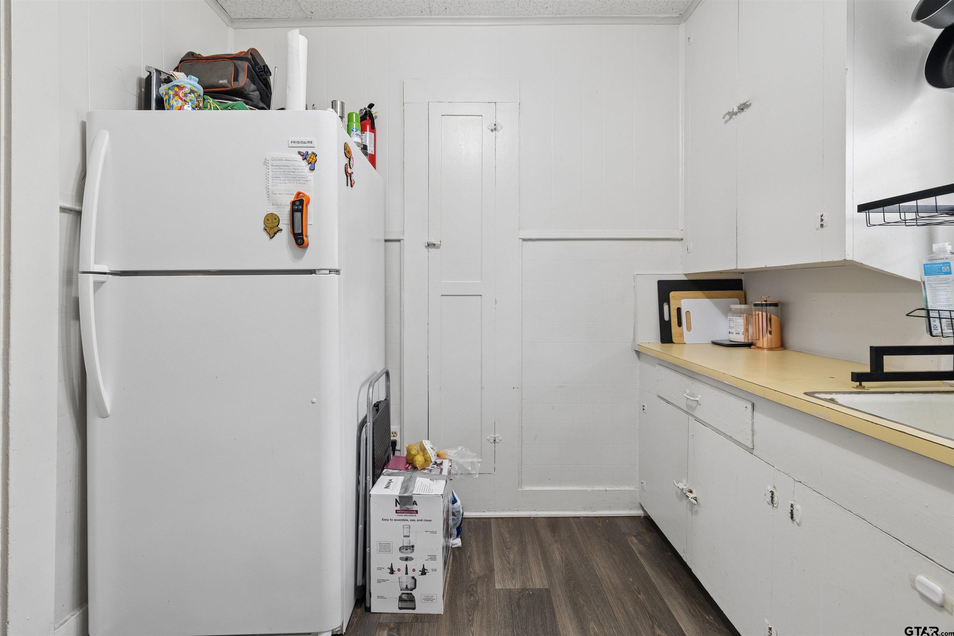 1010 Maple Street Kilgore, TX 75662 - Photo 4 of 20 a white refrigerator freezer sitting inside of a kitchen