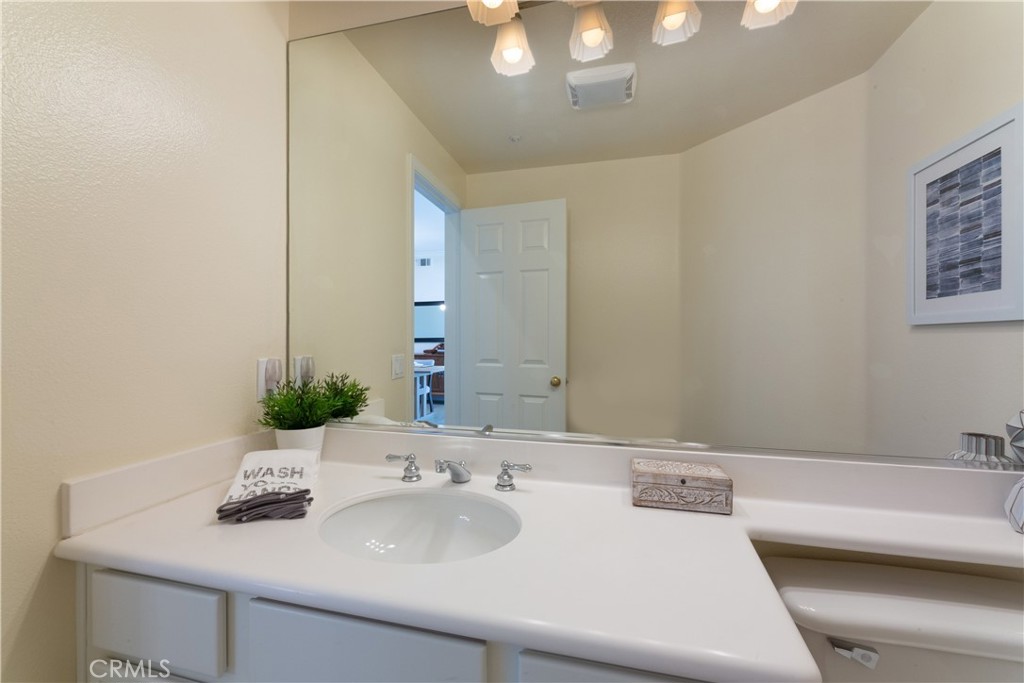 1966 Edinburgh Way Fullerton, CA 92831 - Photo 11 of 59 a bathroom with a sink and a mirror