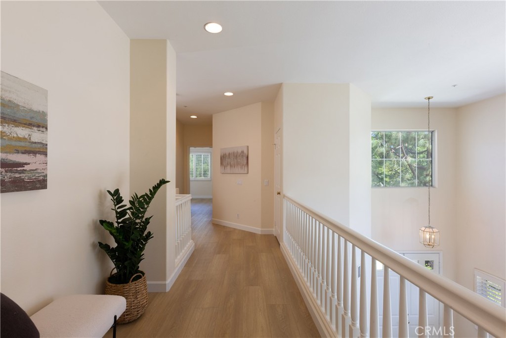 1966 Edinburgh Way Fullerton, CA 92831 - Photo 25 of 59 a view of a hallway with wooden floor