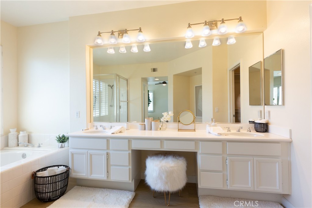 1966 Edinburgh Way Fullerton, CA 92831 - Photo 40 of 59 a bathroom with a sink double vanity and a mirror