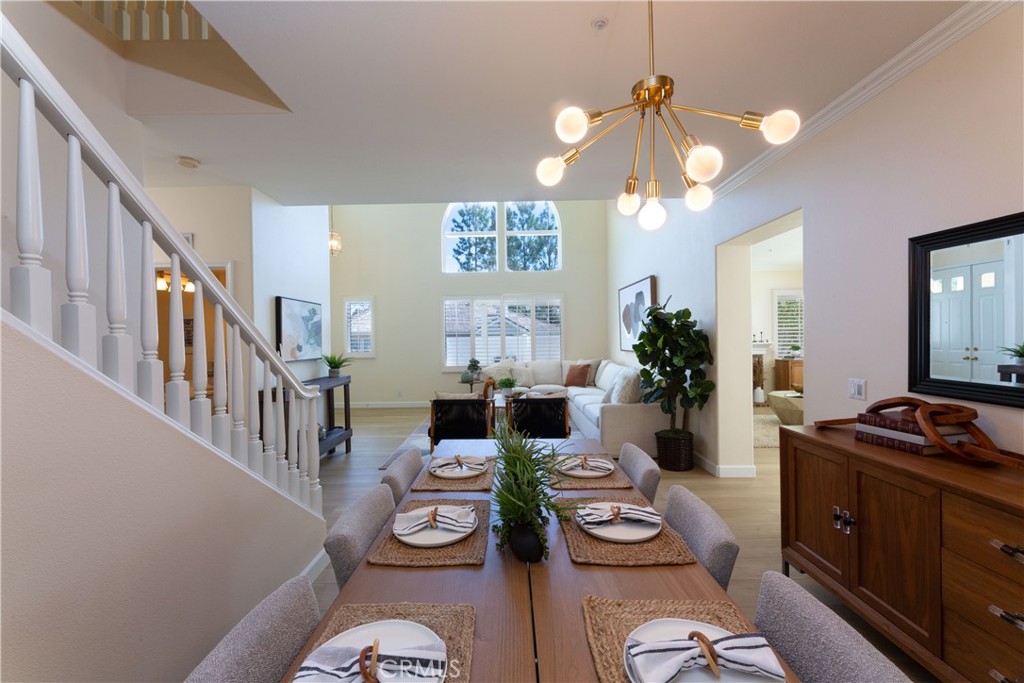 1966 Edinburgh Way Fullerton, CA 92831 - Photo 8 of 59 a view of a dining room with furniture a chandelier and wooden floor