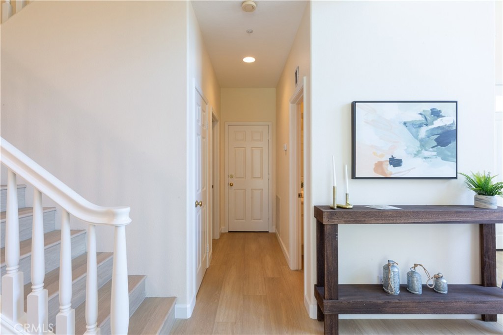 1966 Edinburgh Way Fullerton, CA 92831 - Photo 9 of 59 a view of a hallway with wooden floor and cabinet