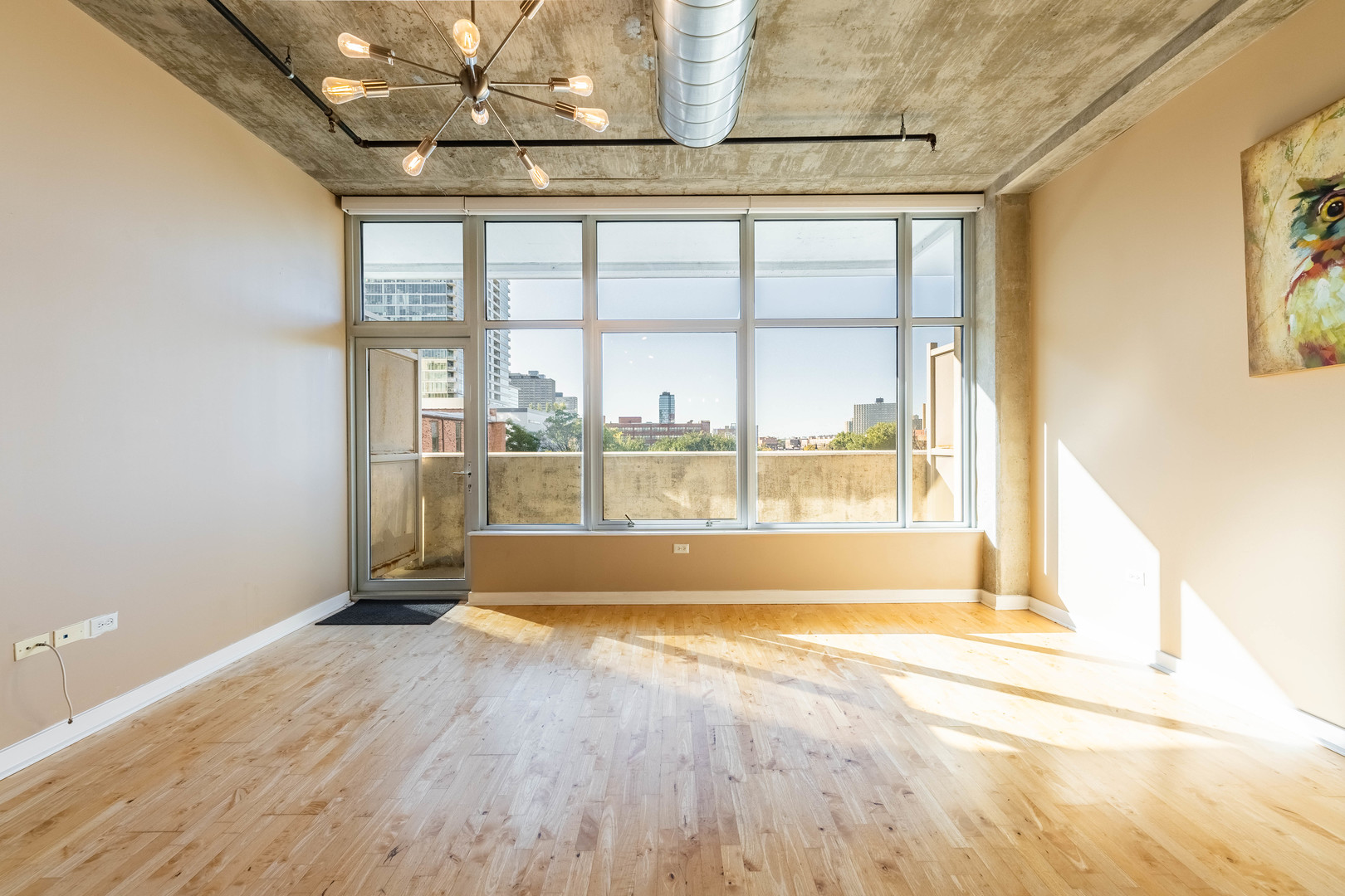50 East 16th Street, Unit 411 Chicago, IL 60616 - Photo 13 of 22 a view of empty room with wooden floor and fan