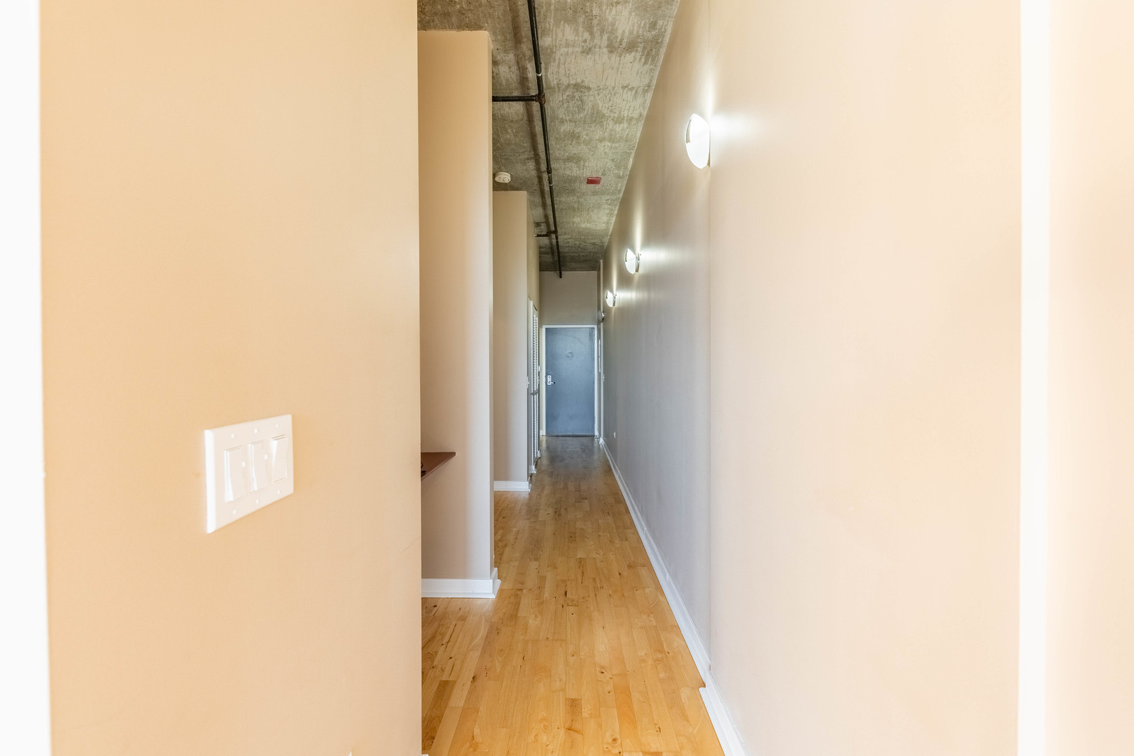 50 East 16th Street, Unit 411 Chicago, IL 60616 - Photo 14 of 22 a view of a hallway with wooden floor