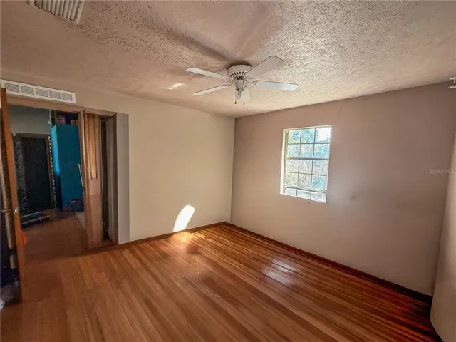 a view of an empty room and glass door