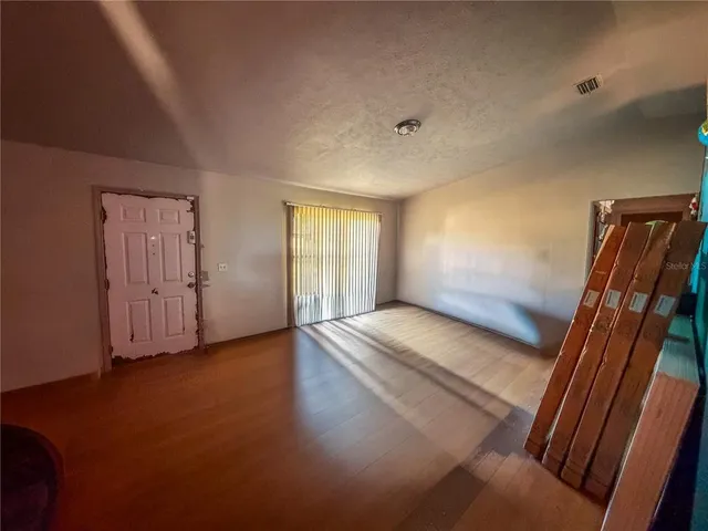 a view of an empty room with empty shelves