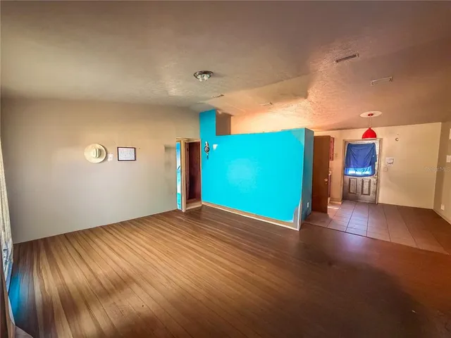 a view of a livingroom with a kitchen