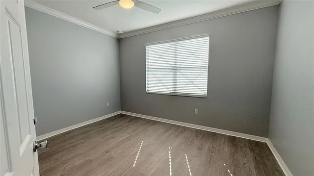a view of a glass door with a balcony from a room