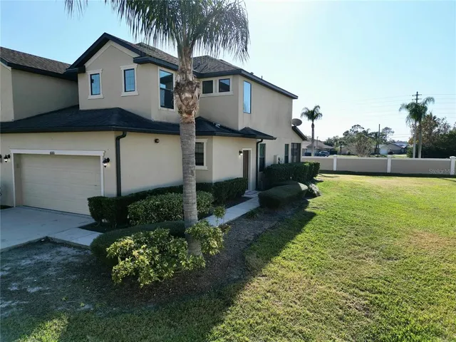 a view of a swimming pool with lawn chairs