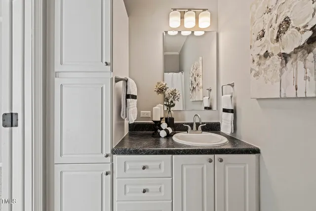 a bathroom with sinks granite and a sink