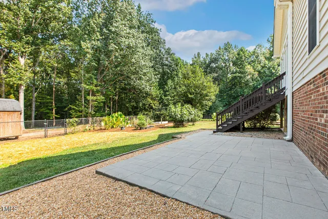 a view of a swimming pool with an outdoor space and seating area