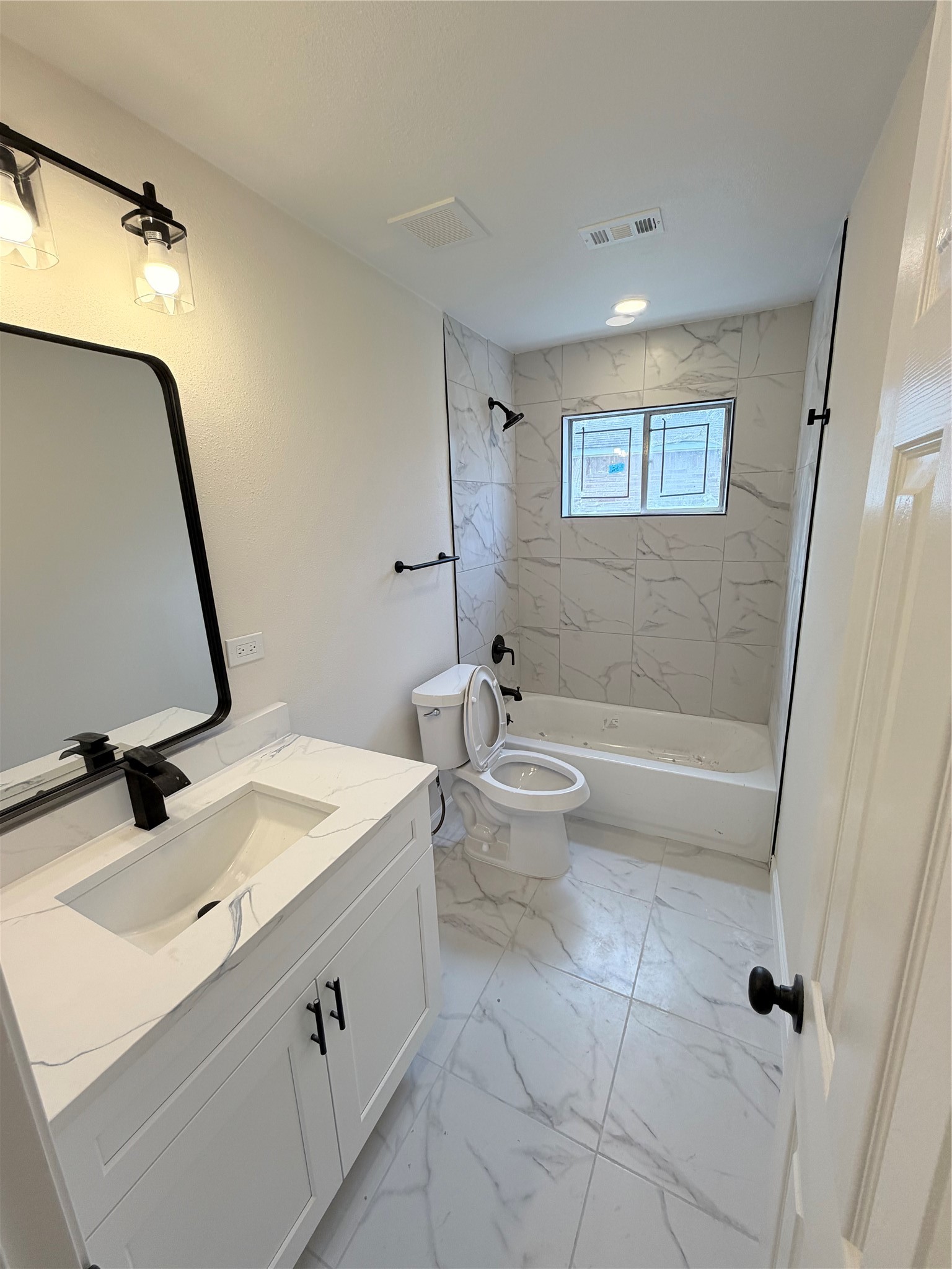 15302 Corsair Road Houston, TX 77053 - Photo 12 of 24 a bathroom with a sink a toilet and a mirror