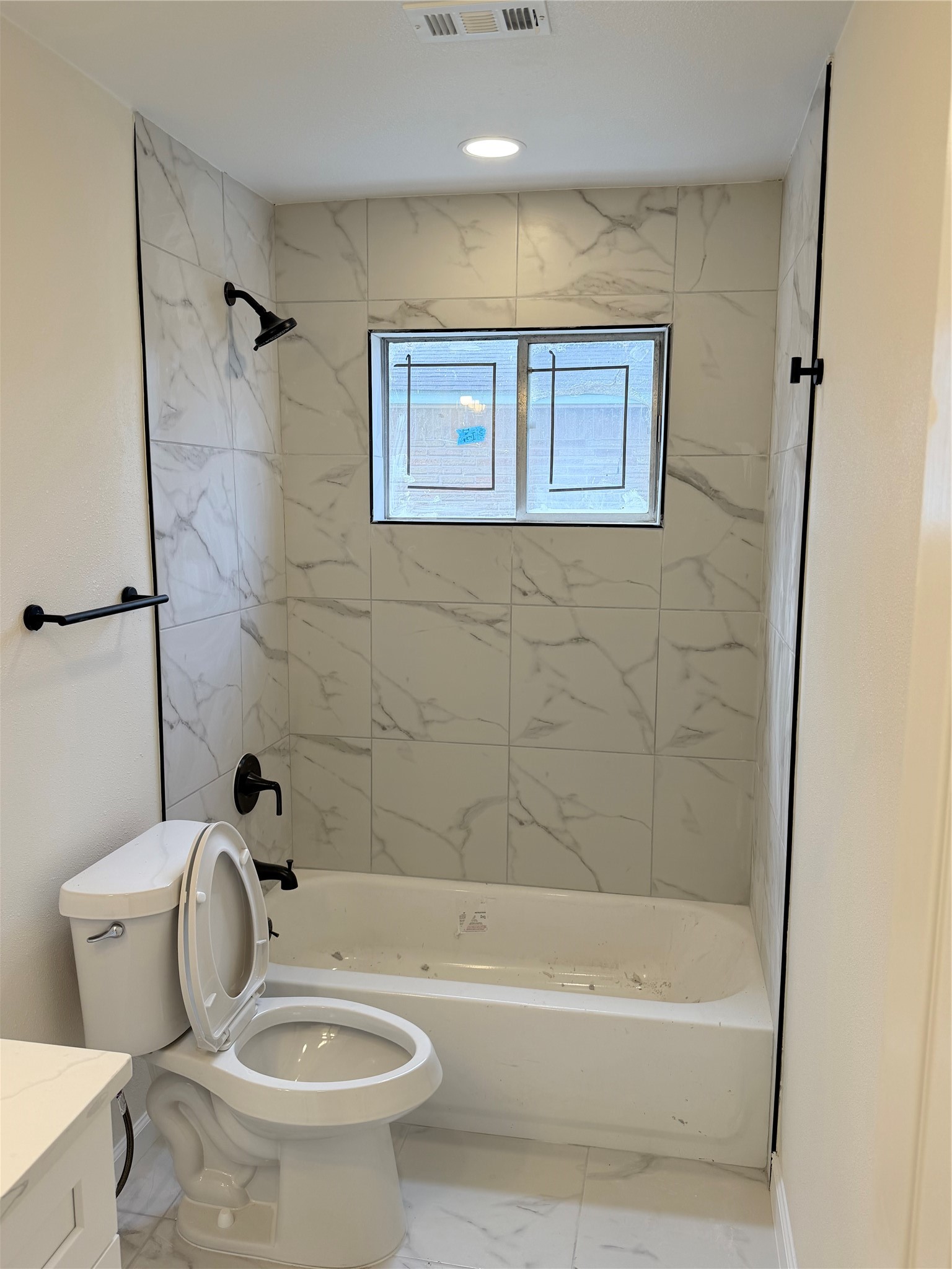 15302 Corsair Road Houston, TX 77053 - Photo 18 of 24 a white toilet sitting next to a bath tub and a shower