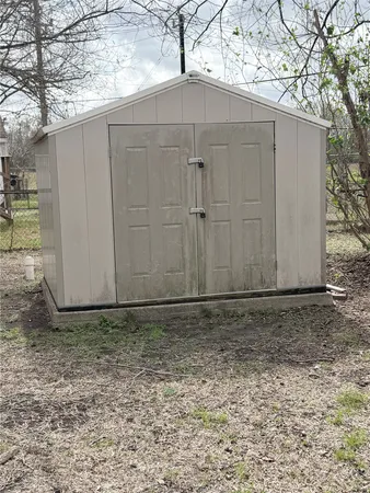 a view of backyard and tree