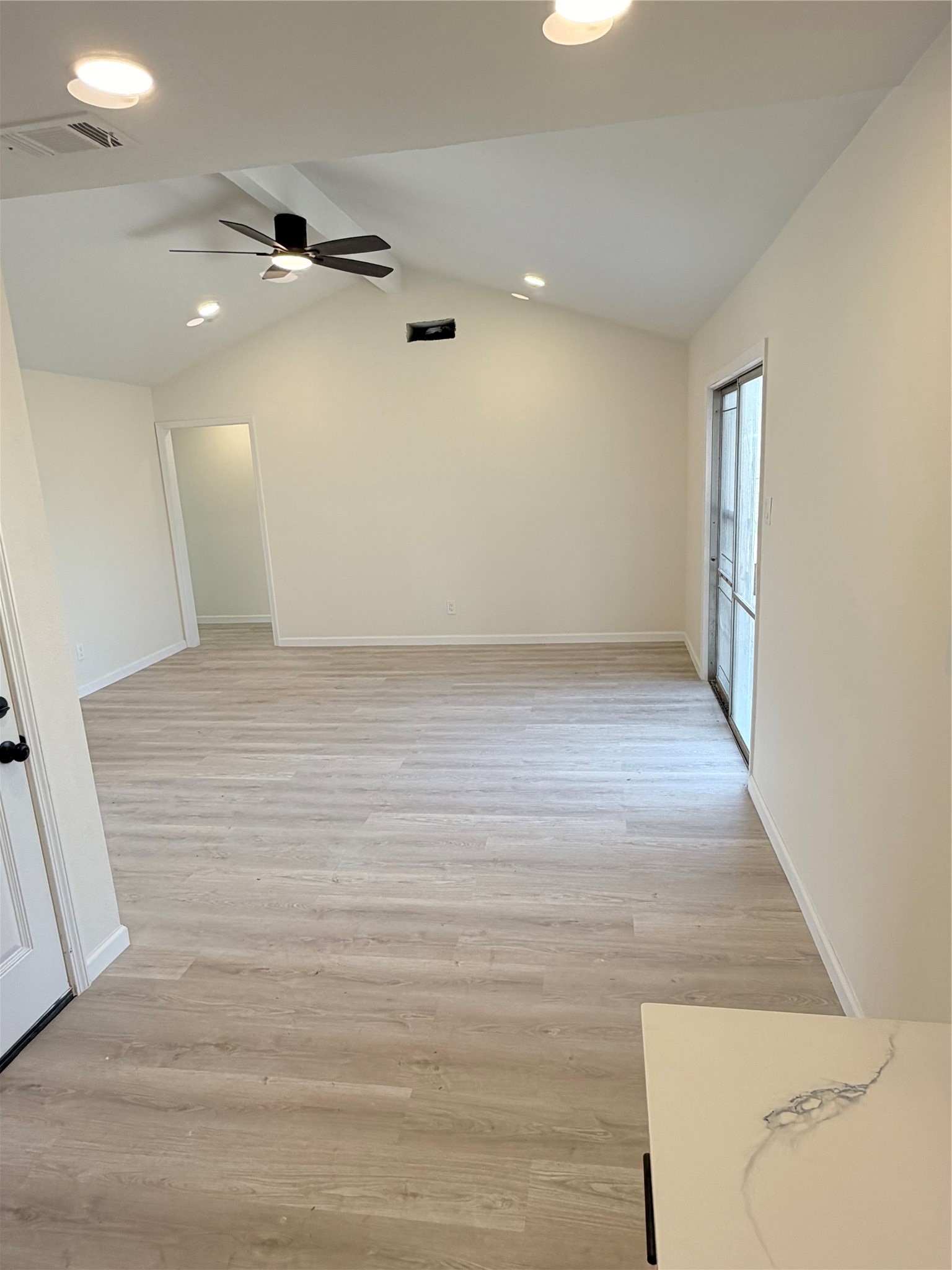 15302 Corsair Road Houston, TX 77053 - Photo 5 of 24 an empty room with wooden floor and windows