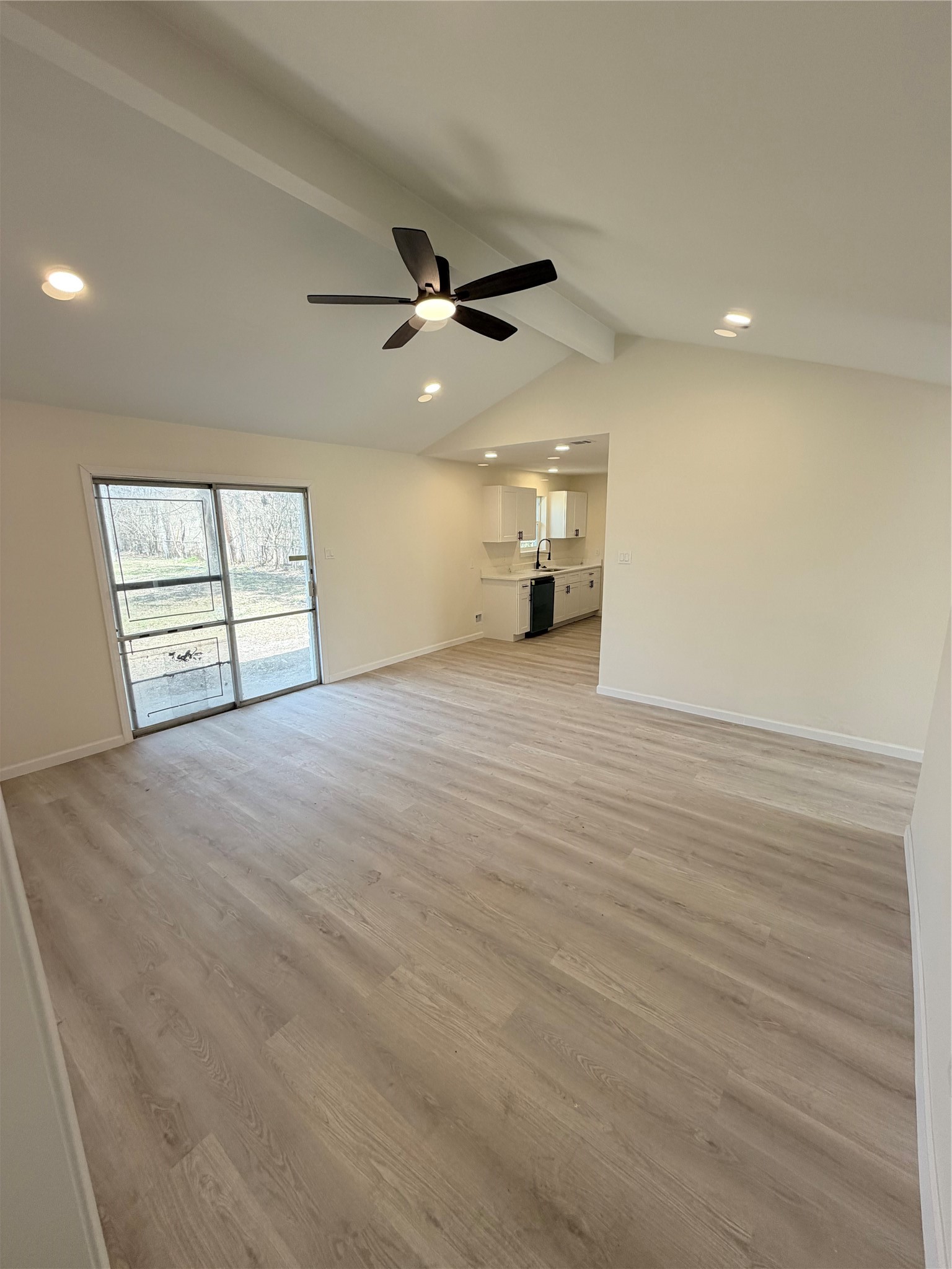 15302 Corsair Road Houston, TX 77053 - Photo 9 of 24 an empty room with windows and ceiling fan