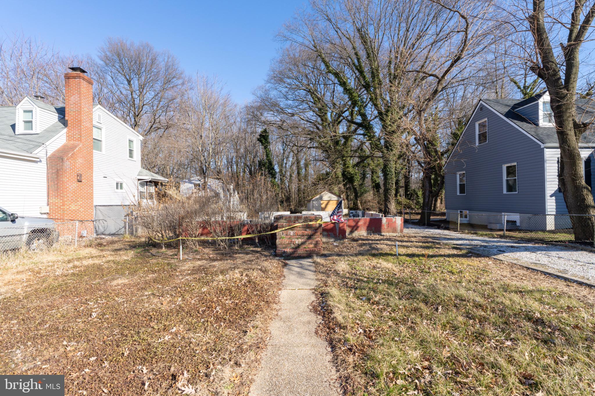 25 Pelczar Avenue Baltimore, MD 21221 - Photo 5 of 14 Charming front walkway through a tranquil yard.