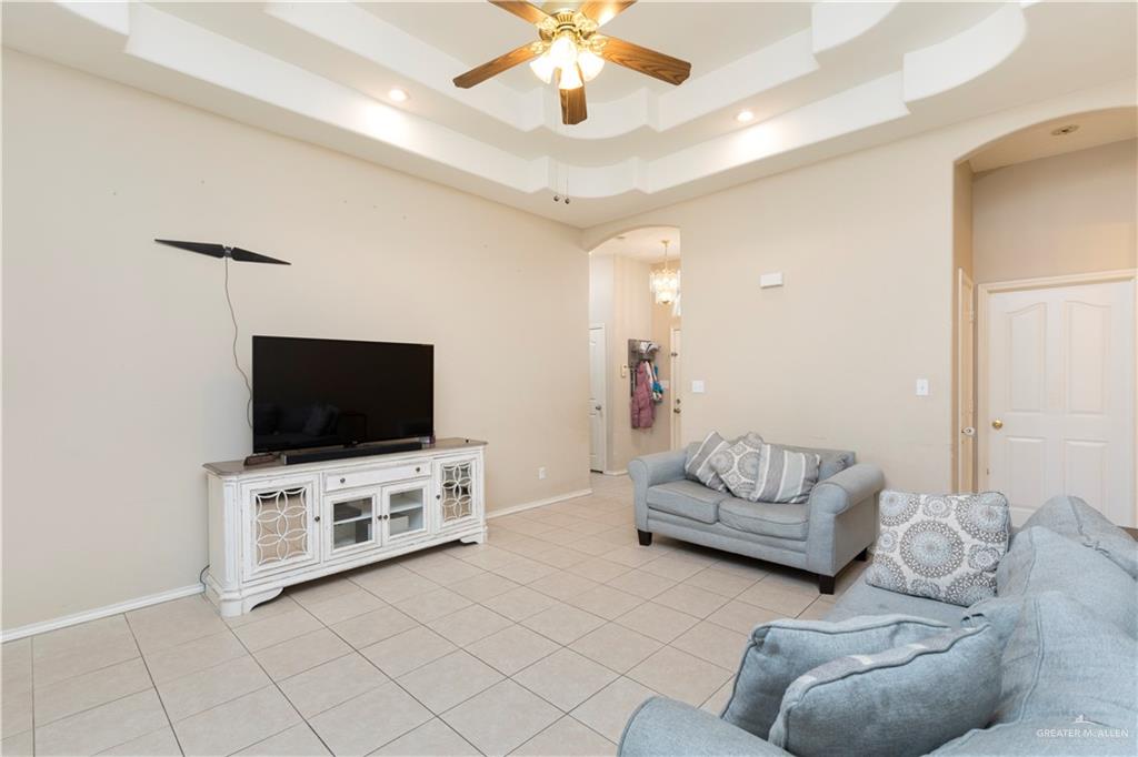 1801 Largo Street Weslaco, TX 78596 - Photo 4 of 20 a living room with furniture and a flat screen tv