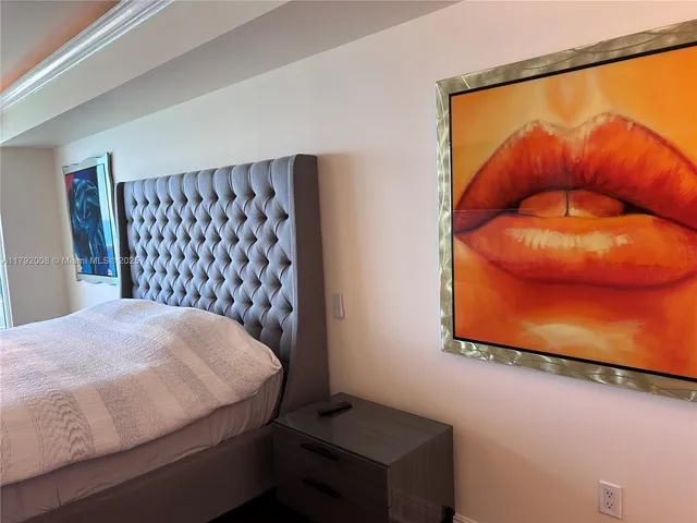 a kitchen with a refrigerator and a stove