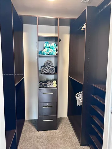 a living room with furniture and flat screen tv