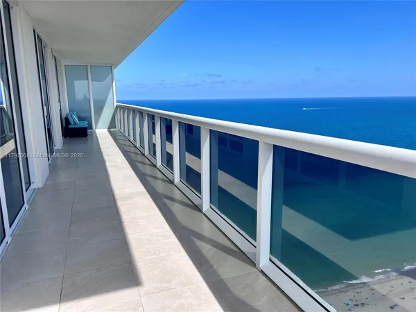 an aerial view of a parking space with city view