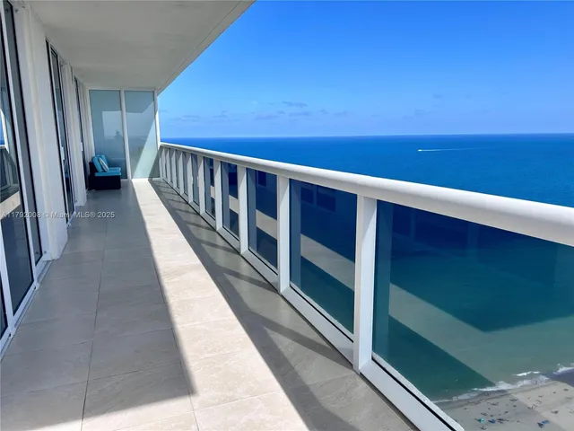 an aerial view of a parking space with city view