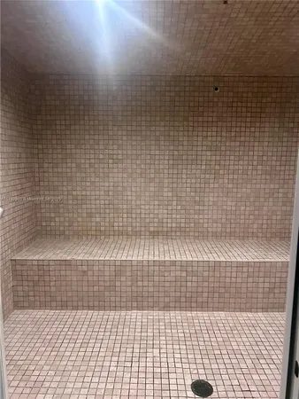 a potted plant sitting in front of a bathroom