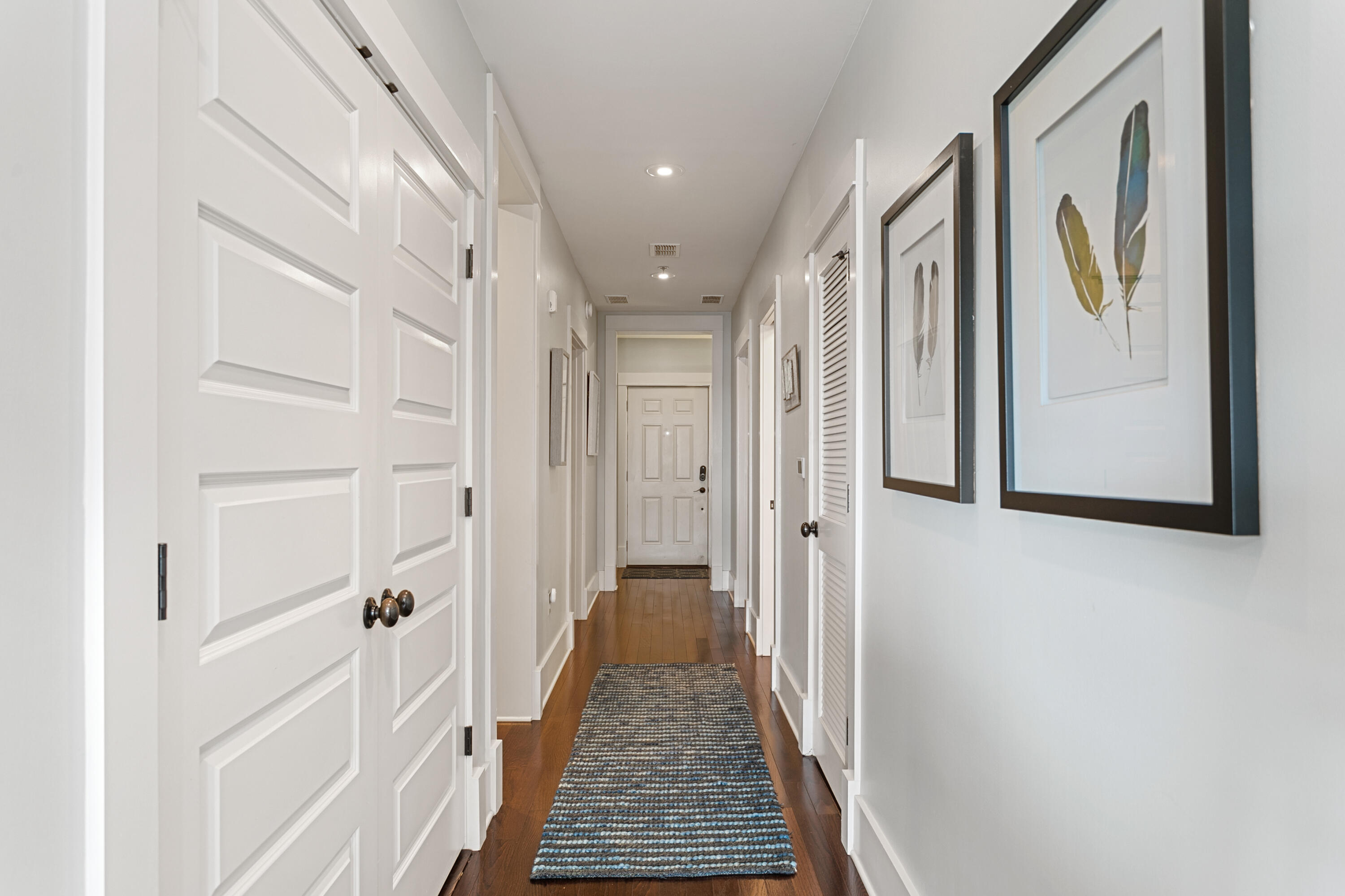 2050 West County Highway 30A, Unit M1314 Santa Rosa Beach, FL 32459 - Photo 2 of 79 a view of a hallway with wooden floor and staircase