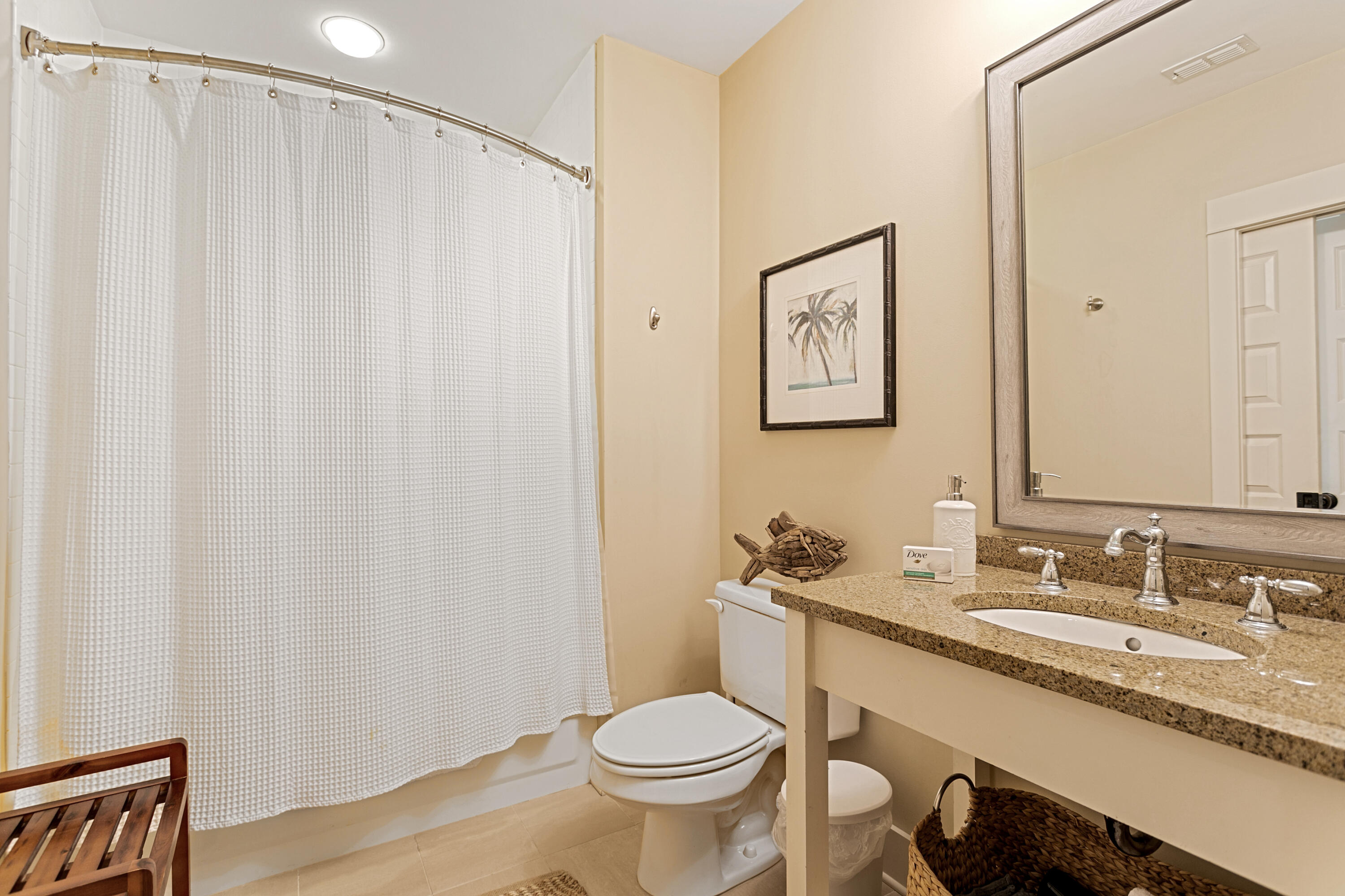 2050 West County Highway 30A, Unit M1314 Santa Rosa Beach, FL 32459 - Photo 36 of 79 a bathroom with a granite countertop sink toilet and a mirror