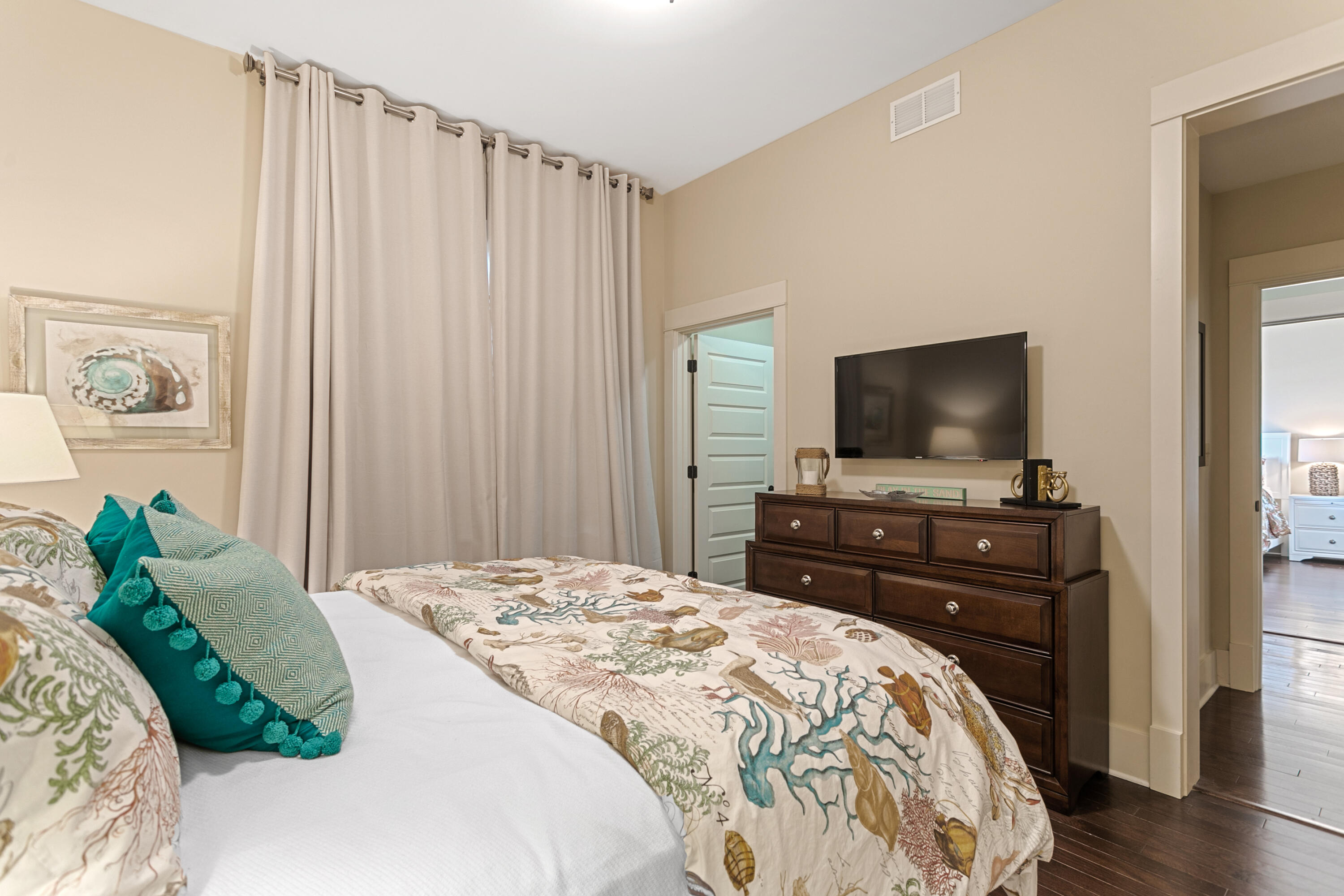 2050 West County Highway 30A, Unit M1314 Santa Rosa Beach, FL 32459 - Photo 40 of 79 a bedroom with a bed and a flat screen tv