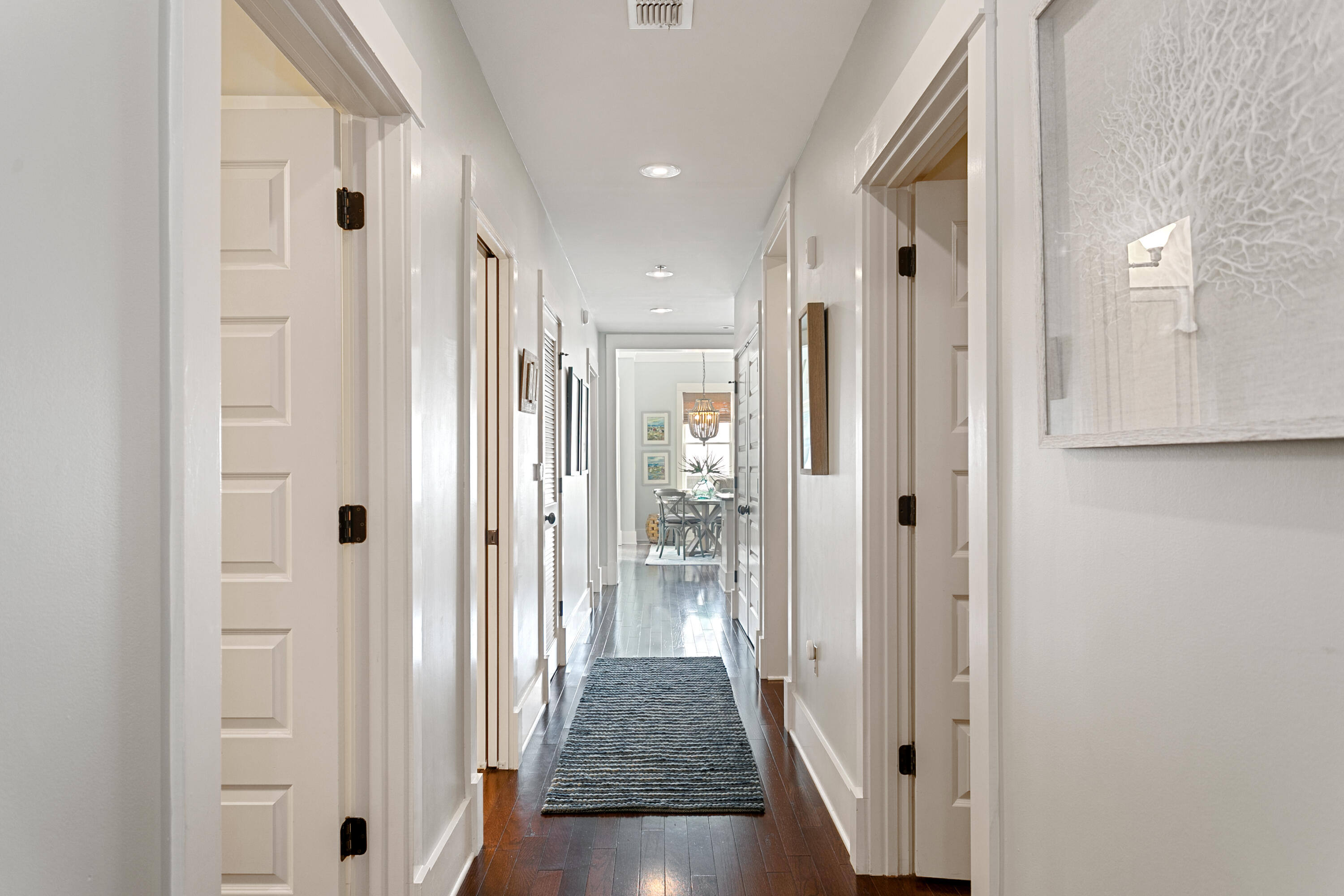 2050 West County Highway 30A, Unit M1314 Santa Rosa Beach, FL 32459 - Photo 4 of 79 a view of a hallway with wooden floor and closet area