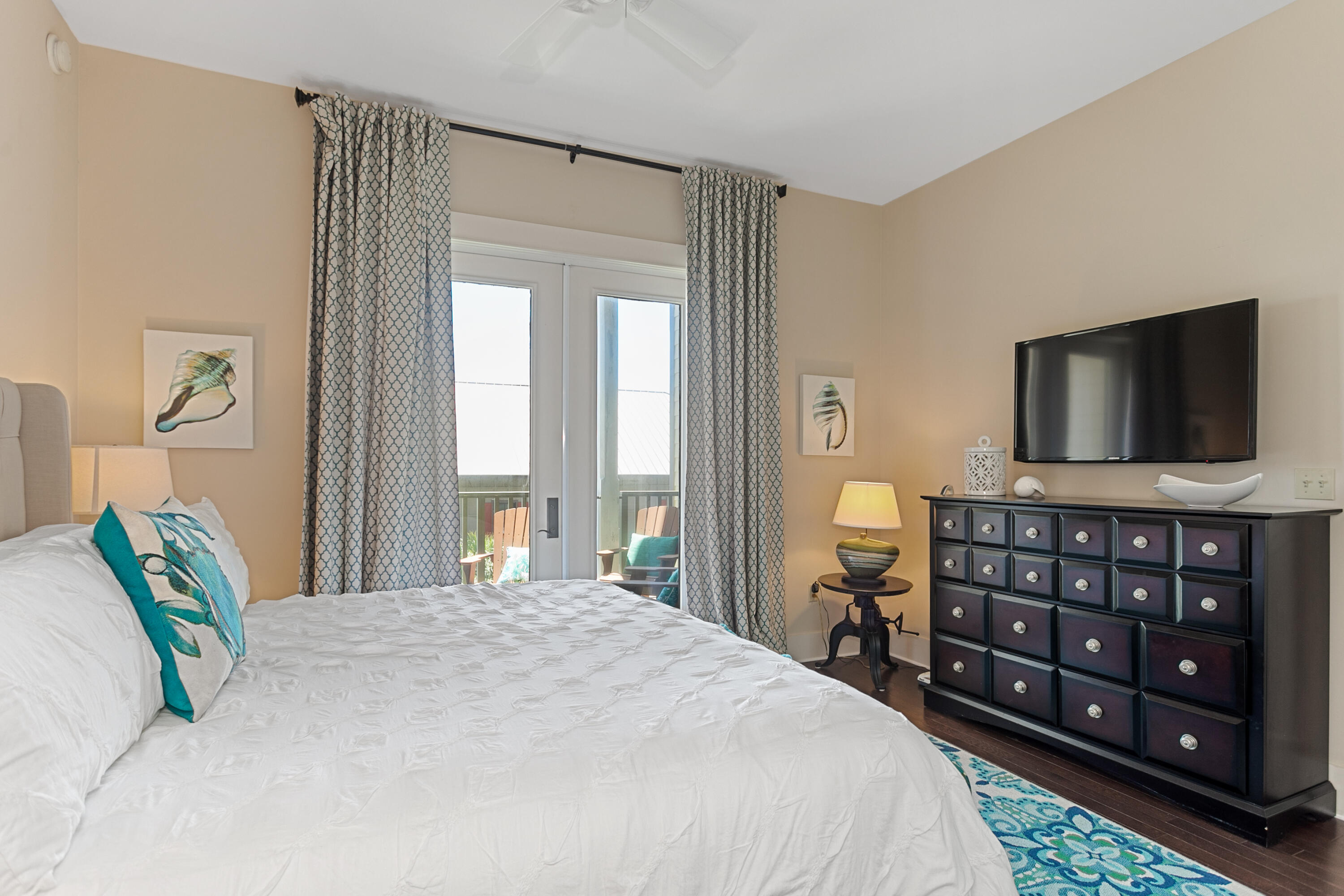 2050 West County Highway 30A, Unit M1314 Santa Rosa Beach, FL 32459 - Photo 50 of 79 a bedroom with a bed a television and a large window