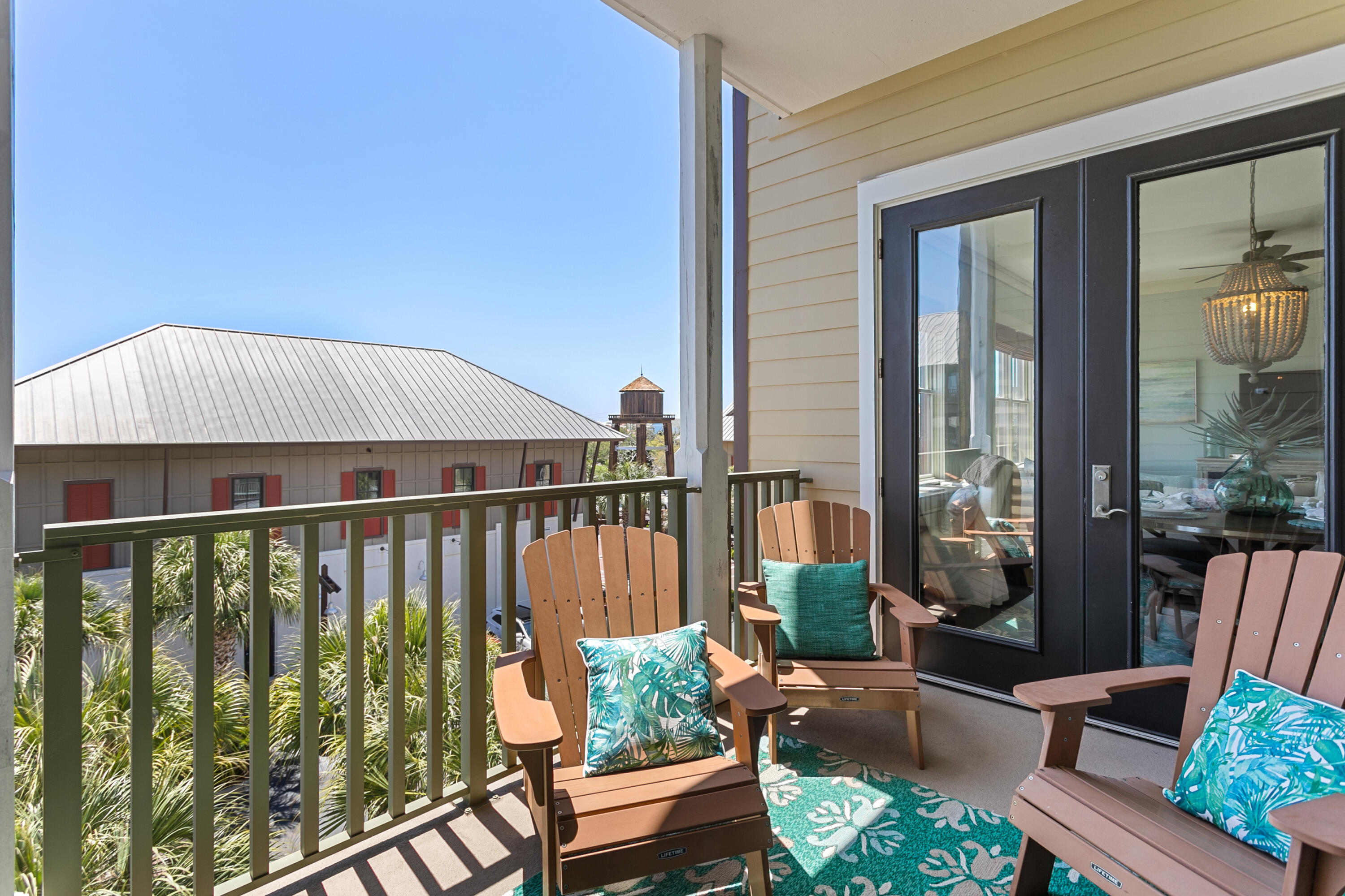 2050 West County Highway 30A, Unit M1314 Santa Rosa Beach, FL 32459 - Photo 59 of 79 a balcony with wooden floor table and chairs