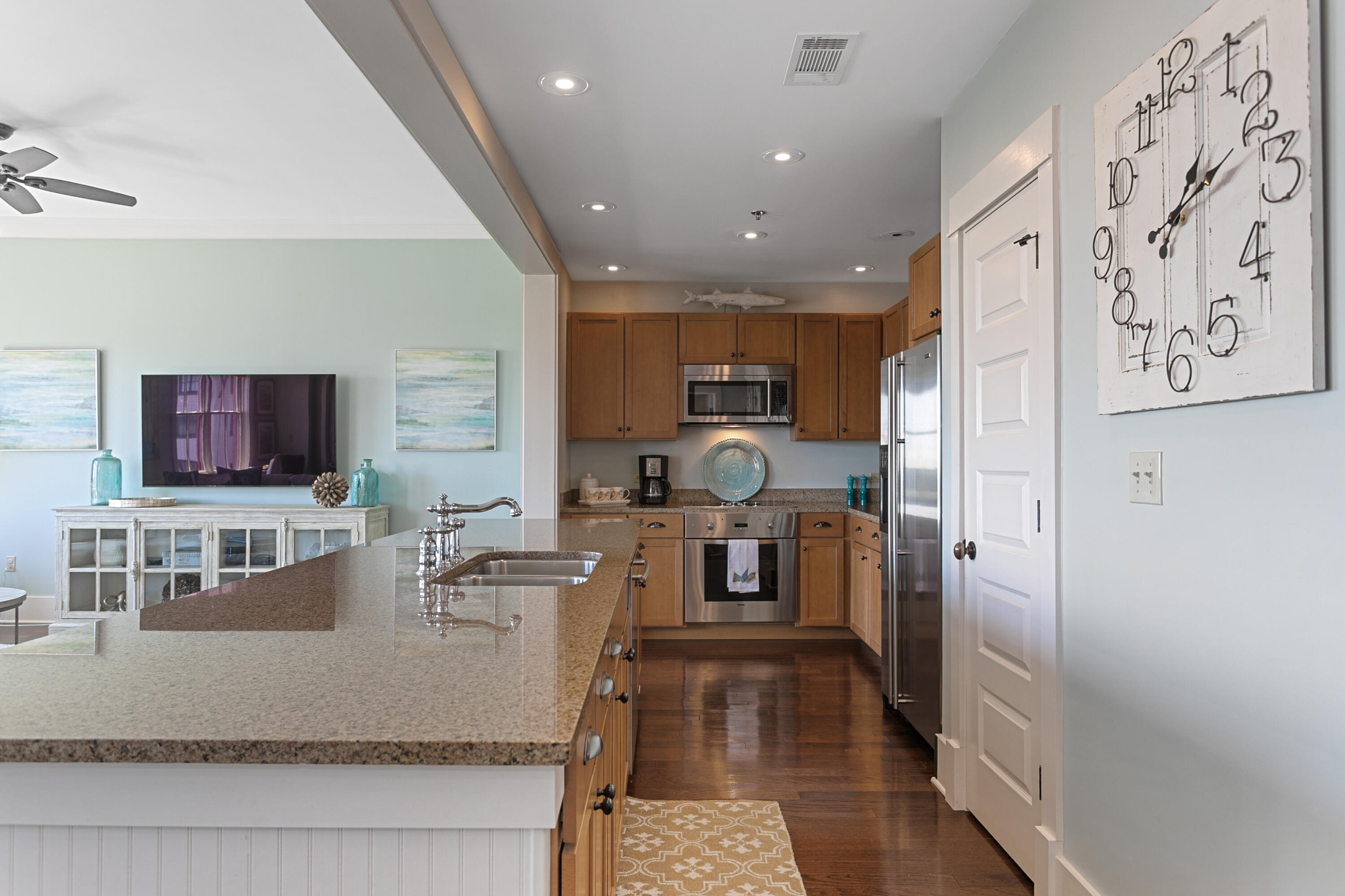 2050 West County Highway 30A, Unit M1314 Santa Rosa Beach, FL 32459 - Photo 6 of 79 a large kitchen with stainless steel appliances granite countertop a refrigerator a stove a sink and a microwave