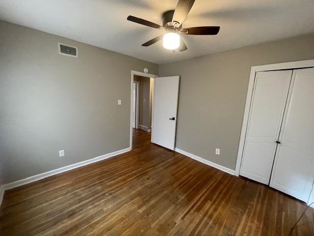 3602 Hallbrook Street Memphis, TN 38127 - Photo 9 of 12 Unfurnished bedroom featuring dark wood-style flooring, ceiling fan, and a closet