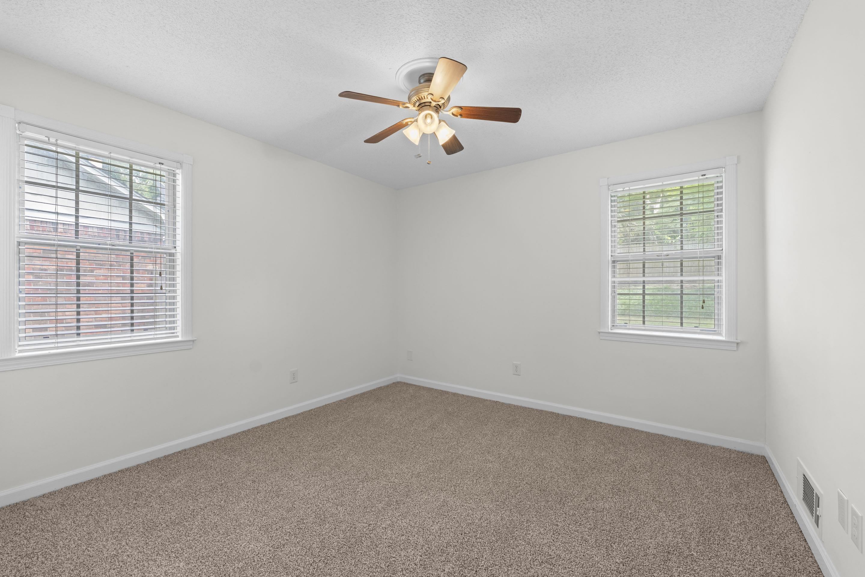 499 Duscoe Street Collierville, TN 38017 - Photo 21 of 38 an empty room with a window and a fan