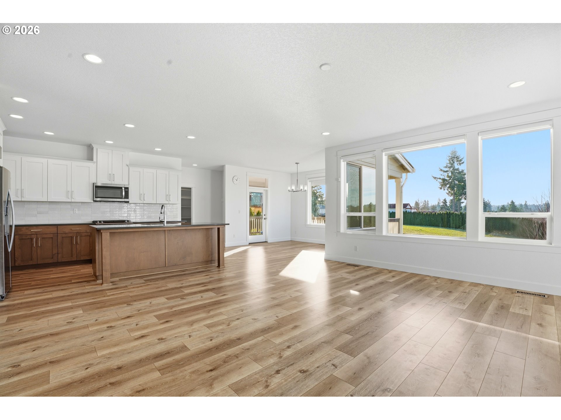 14146 South Cleveland Street Oregon City, OR 97045 - Photo 17 of 46 a view of kitchen with wooden floor