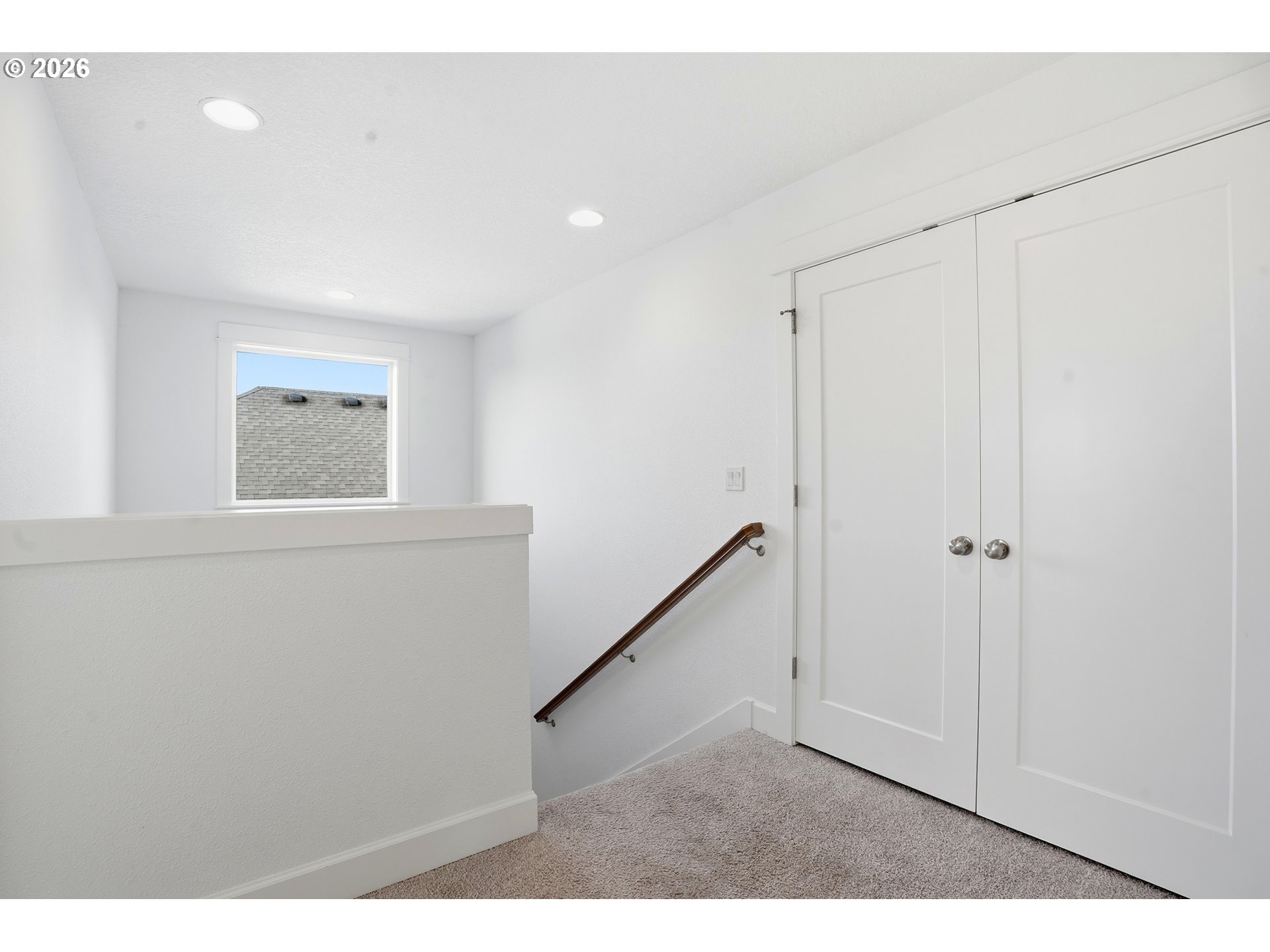 14146 South Cleveland Street Oregon City, OR 97045 - Photo 19 of 46 a view of an empty room with wooden floor